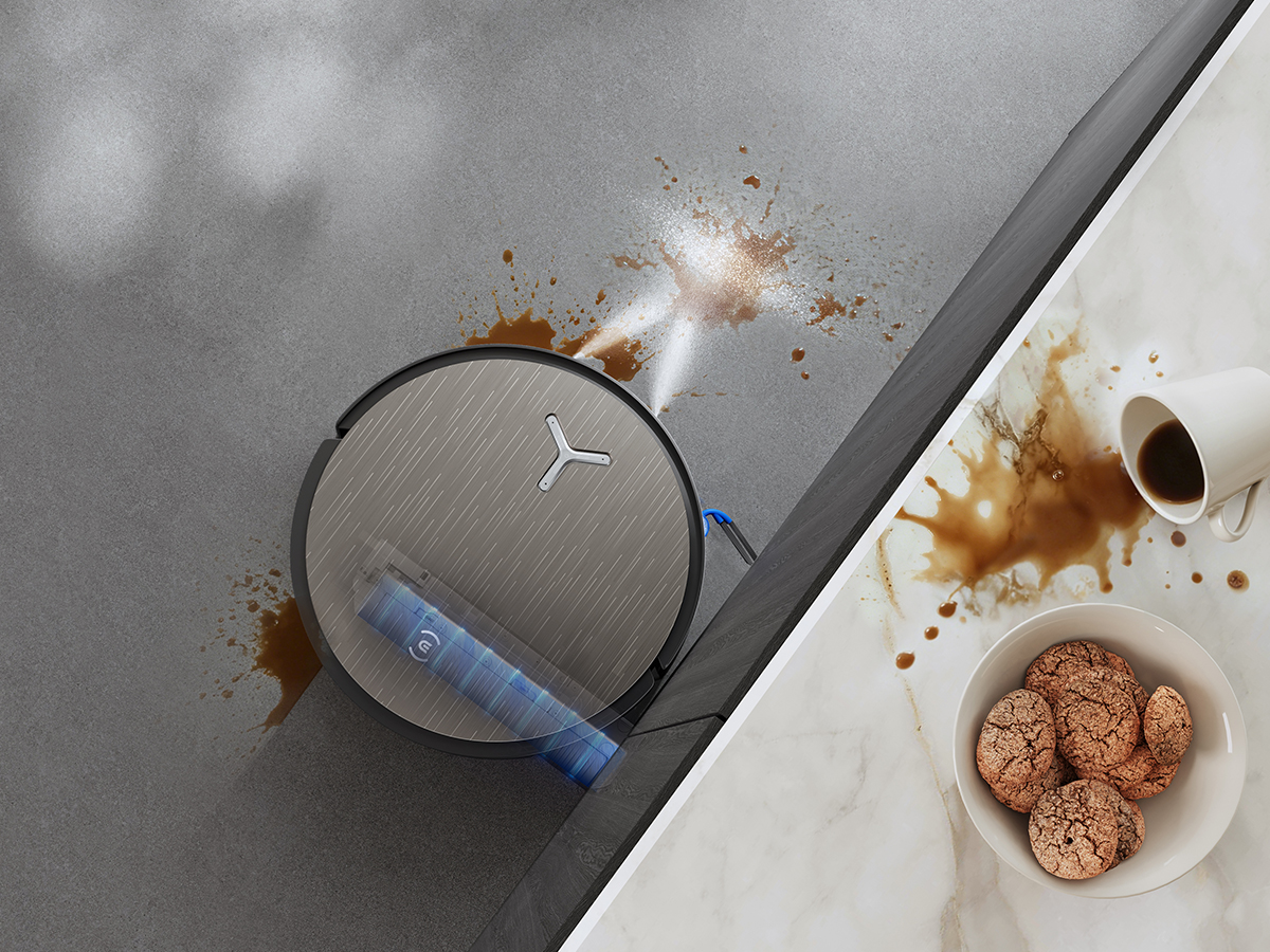 Official ECOVACS X12S illustration showing FocusJet spraying a kitchen floor stain